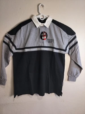 Polo Guinness Hombre Rugby Negro Y Gris, Con Cuello Blanco, Manga Larga. Foto 1 de 4