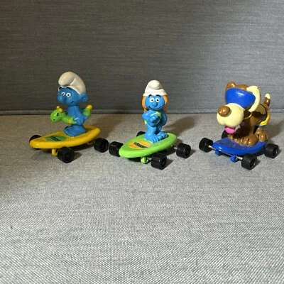Lote de figuras de PVC de colección Hardees 1990 Pitufos Skateboard Peyo Aplause Foto 1 de 4