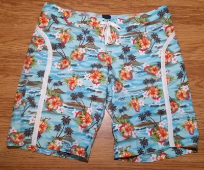 Board Shorts Roxy (Talla 7) Azul Océano y Patrón Floral, Cordón Frontal Foto 1 de 4