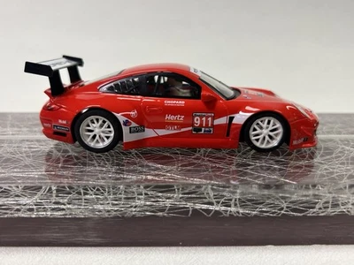 Carro caça-níqueis NSR 0524AW Porsche 997 GT3 #911 Coca Cola IMSA 2019 1/32 - Imagem 1 de 4