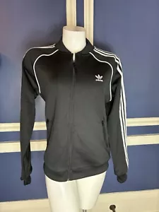 NUEVO CON ETIQUETAS ADIDAS MUJER CHAQUETA DEPORTIVA NEGRA ESSENTIALS SUDADERA CREMALLERA COMPLETA TALLA MEDIANA - Imagen 1 de 11