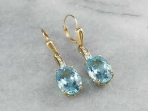 Pendientes colgantes y aguamarina simulada de corte ovalado de 4 quilates chapados en oro amarillo de 14 quilates - Imagen 1 de 6
