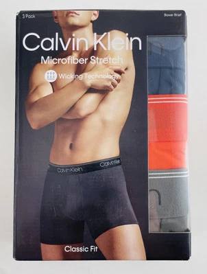 Paquete de 3 calzoncillos boxer elásticos de microfibra para hombre Calvin Klein azul marino, rojo, gris - grandes Foto 1 de 3