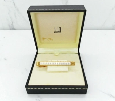 Clip de corbata Dunhill logotipo tono dorado plateado con caja usado Foto 1 de 4