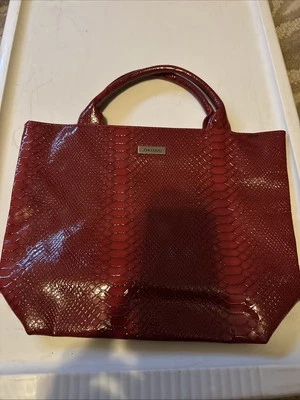 Bolso de mano Shiseido rojo Foto 1 de 3