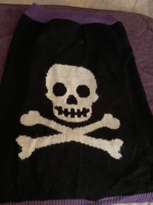 MARTHA STEWART PETS LARGE SWEATER BLACK AND PURPLE WITH SKULLS GENTLY USED - Image 1 of 2