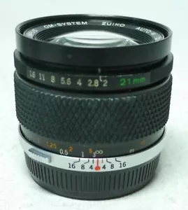 Olympus OM Zuiko Auto-W 2,0 21mm Objektiv An-Verkauf ff-shop24 - Bild 1 von 6