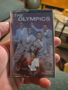 1987 The Olympics 12 greatest cassette tape P0 57107 - Bild 1 von 3