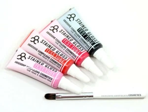 Tubo de prueba de brillo labial manchado cosméticos obsesivos compulsivos 4 piezas conjunto raro nuevo en caja - Imagen 1 de 3
