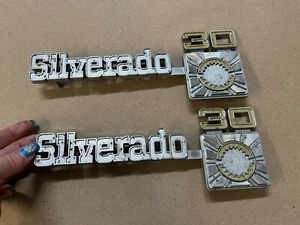 73-80 Chevrolet Chevy Silverado 30 Truck Fender Emblems Pair 1973-1980 OEM - Picture 1 of 5