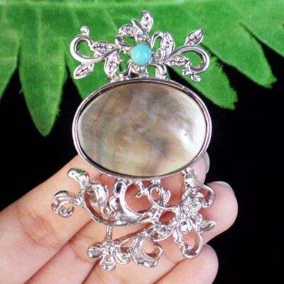 SK62425 Wrap Natural Gray Shell Oval Tibetan Silver Flower Pendant Bead - Image 1 of 3