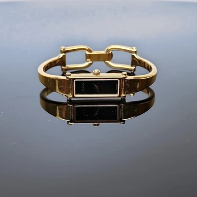 GUCCI 1500 Gold Bangle Bracelet Watch Vintage Ladies Black Dial Swiss Quartz⭐ - Image 1 of 4