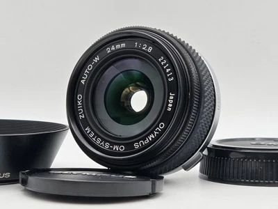 Lente principal gran angular [N.COMO NUEVA CON CAPUCHA] Olympus OM-SYSTEM Zuiko Auto-W 24 mm F2,8 Foto 1 de 4