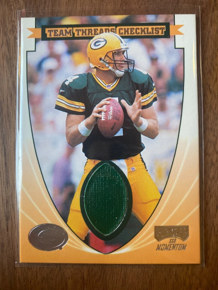 A53,593 - 1999 Playoff Momentum SSD Team Thread Checklists #TTC25 Brett Favre - Image 1 of 1