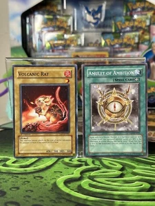 Amuleto de ambición TAEV-EN061 + RATA VOLCÁNICA TAEV-EN002 - Yu-Gi-Oh! - Imagen 1 de 6