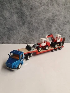 siku 3911 Scania 143 H con excavadora móvil 2225 O+K + cargadora de ruedas 1924 1:55 -90 iger-mint - Imagen 1 de 12