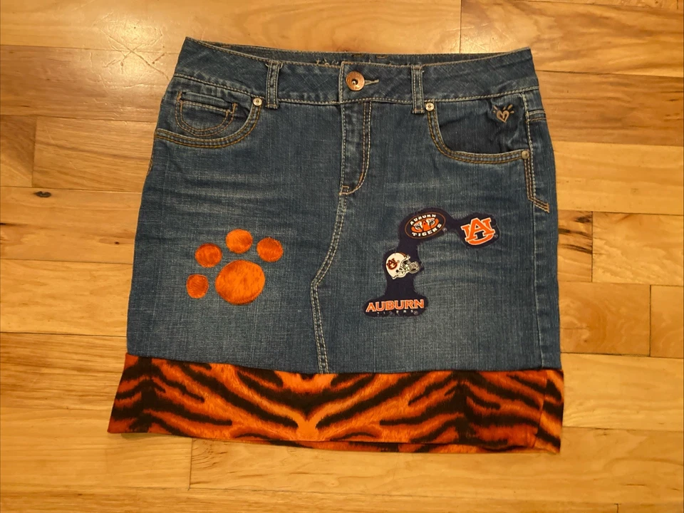 Falda vaquera azul justicia de los tigres castaño rojizo etiqueta 16 talla 29 x 17 Foto 1 de 4