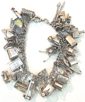 Brazalete mecánico vintage de plata de ley con 30 dijes de mudanzas articuladas Foto 1 de 4