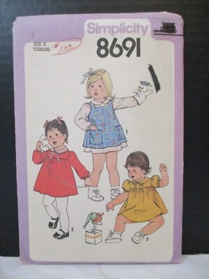 Simplicity Pattern 8691 Dress & Pinafore long/Short  Sleeves Toddler Girl Size 2 - Image 1 of 4