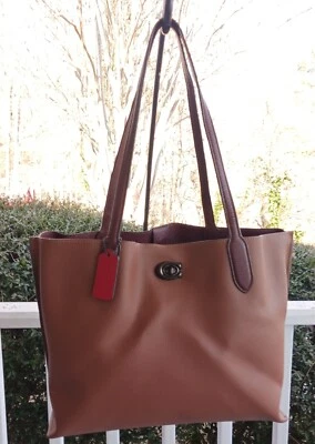 Bolso de hombro Coach C0692 Work Sauce Saddle de cuero marrón con detalle de bloqueo giratorio Foto 1 de 4