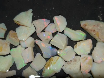 Lot 21 -  223ct Coober Pedy White Opal With Ultra Bright Red - image 1 of 4