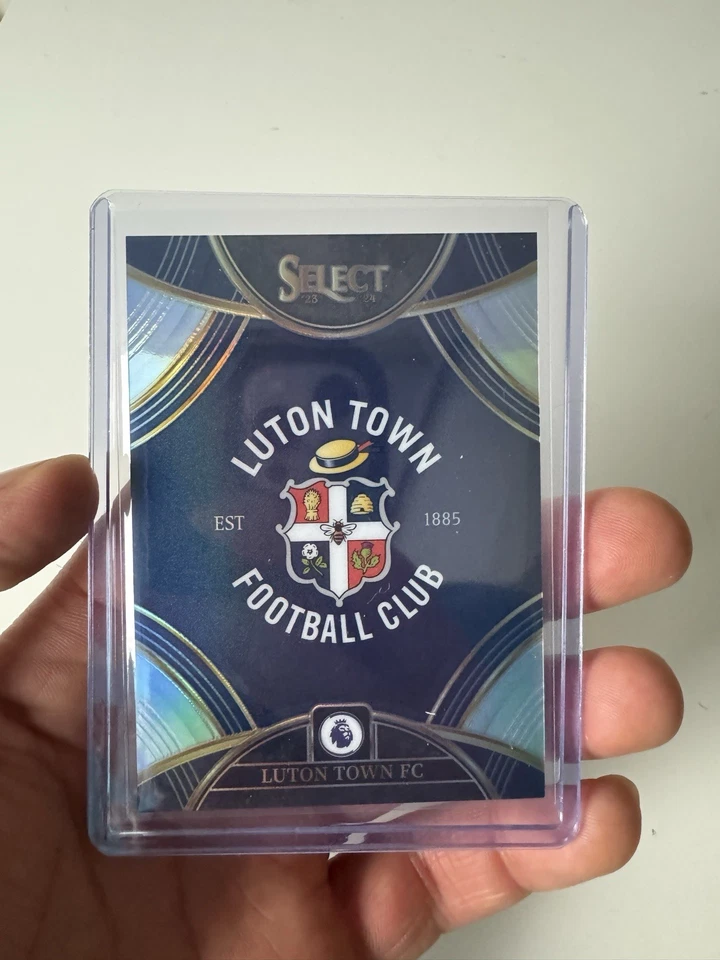 2023-24 Panini Select EPL Luton Town FC SSP Team Badge Card #12 Prizm CASE HIT - Image 1 of 3