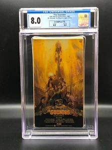 The Goonies (1985) First Print, 1986 VHS 11474, KHAKI Guard - CGC 8.0 - COMPLETE - Picture 1 of 8