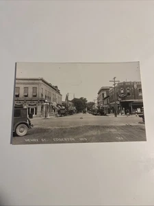 Vintage RPPC Street Scene Henry Street Edgerton Wisconsin Stores Cars Buildings - Photo 1/15
