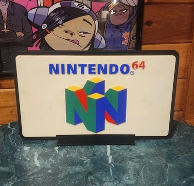 Letrero promocional vintage N64 Electronics Boutique c. 1995-96 juegos clásicos de 2 caras Foto 1 de 4