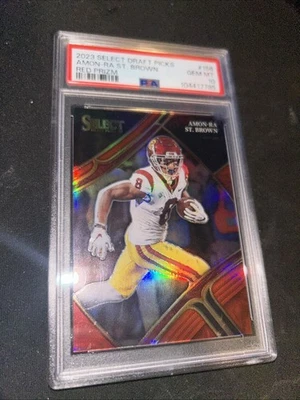 2023 Panini Select Draft Picks  Amon-Ra St. Brown #156 Red Prizm /149 - Image 1 of 4