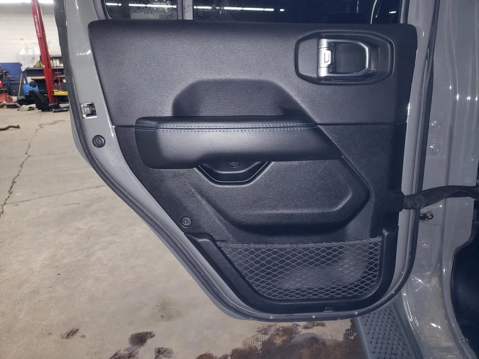 21 22 23 WRANGLER 4XE Left Rear Door Trim Panel Black Leather D5X9 Blue Stitch - Image 1 of 4