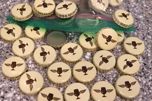 100 PCS WILD HEAVEN CRAFT BEER BOTTLE CAPS CREAM BROWN WINGS NO DENTS - Picture 1 of 1
