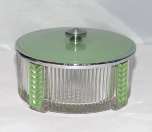 Tarro tocador vintage con patas de vidrio transparente en polvo con tapa de metal verde Art Deco - Imagen 1 de 9