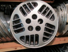 One 1992 to 1994 Pontiac Sunbird Grand AM bolt on 14 inch hubcap wheel cover