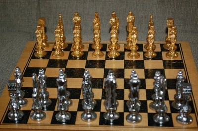 GOLD AND SILVER WEIGHTED METAL CHESS SET - Image 1 of 4