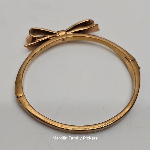 Bracciale Kate Spade New York tono oro fiocco cerniera GU design classico