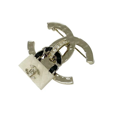 Broche CHANEL corpete ouro branco preto marca de coco strass 3,5x4,5cm usado - Imagem 1 de 4