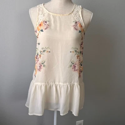 Blusa Xhilaration túnica peplum transparente con detalle floral y encaje talla M Foto 1 de 4