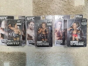 UFC--Randy Couture, Georges St. Pierre, And Tito Ortiz - Picture 1 of 10