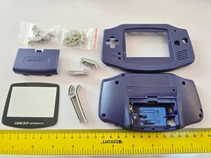 KIT CARCASA CONSOLA NINTENDO GAMEBOY ADVANCE GBA REPUESTO COMPLETO Púrpura TOTALMENTE NUEVO - Imagen 1 de 2