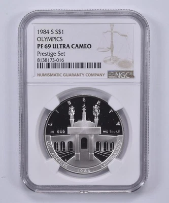 1984-S Olympic Commemorative Dollar Prestige Set PF69 UCAM NGC Brown Label *0588 - Image 1 of 4