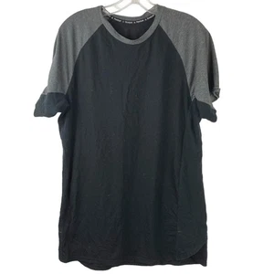 Camiseta negra para hombre REEBOK con manga gris raglán malla laterales talla mediana - Imagen 1 de 3