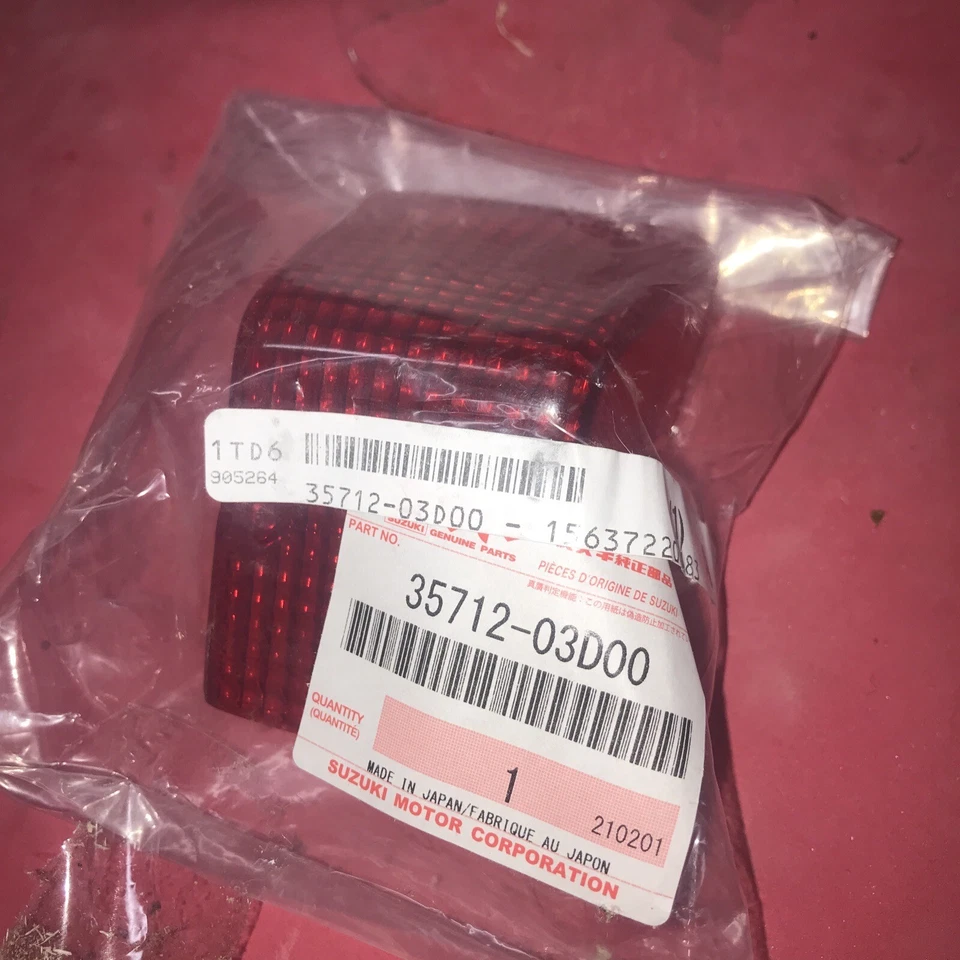 Lente de luz trasera Suzuki NOS OEM 35712-03D00 DR350 RMX250 Foto 1 de 1