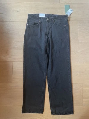 NUEVO CON ETIQUETAS H&M Pantalones de mezclilla holgados cintura baja negros calce relajado TALLA 8 para mujer Foto 1 de 4