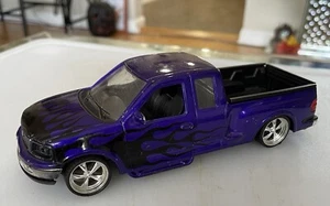 Ford F-150 Flareside Supercab DieCast LowRider PURPLE w/Bk Flames Welly - Picture 1 of 6