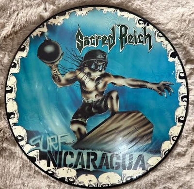 Sacred Reich - Surf Nicaragua PICTURE DISC Vinyl LP - Bild 1 von 3