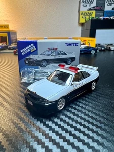 Tomica Limited Vintage Neo 1/64 Nissan GT-R R33 Japanese Patorl Car Diecast - Picture 1 of 3