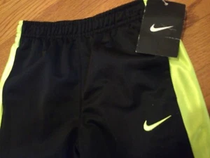 NWT, $30. MSRP,  Boys Nike Sweatpants Size 4  Black / Volt  Style # 862110-KE4 - Picture 1 of 4
