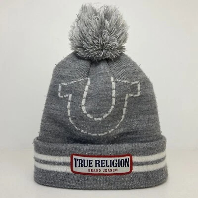 Pantalones de mezclilla marca True Religion gorro sombrero de invierno gorra gris parche con logotipo pompón Foto 1 de 4