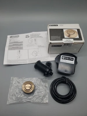 Interruptor de aire para eliminación de basura Delta 72050-CZ, bronce champán - Imagen 1 de 4